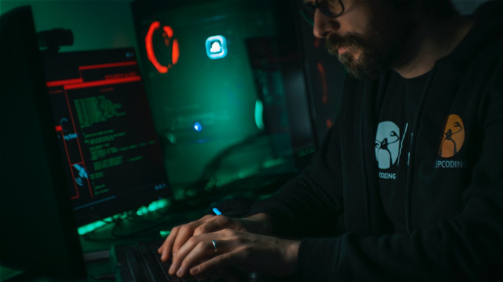 man in black jacket using computer